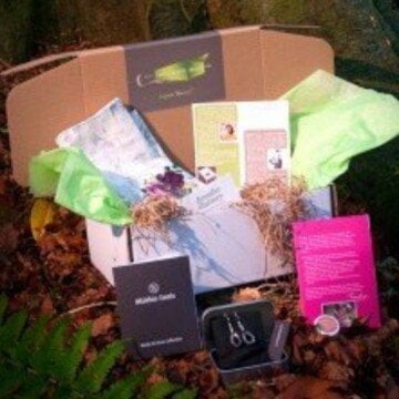 An open giftbox featuring crafts and gifts from My Ireland Box subscription services