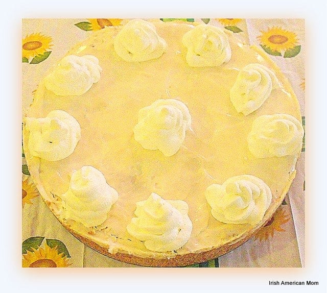 Irish Cream Pumpkin Cheesecake | Irish American Mom A full cheesecake with cream decorative swirls