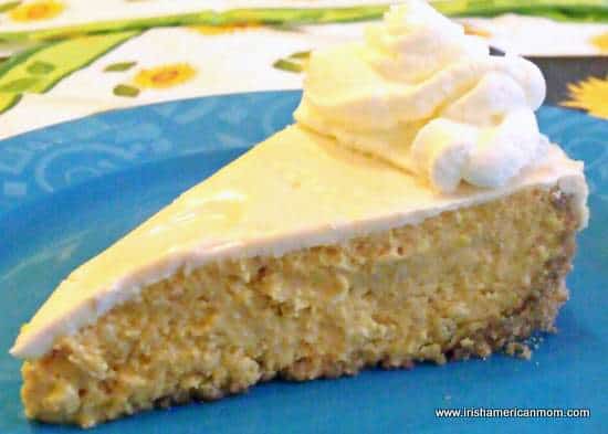 Slice of Baileys pumpkin cheesecake with cream | Irish American Mom Slice of Baileys pumpkin cheesecake with cream