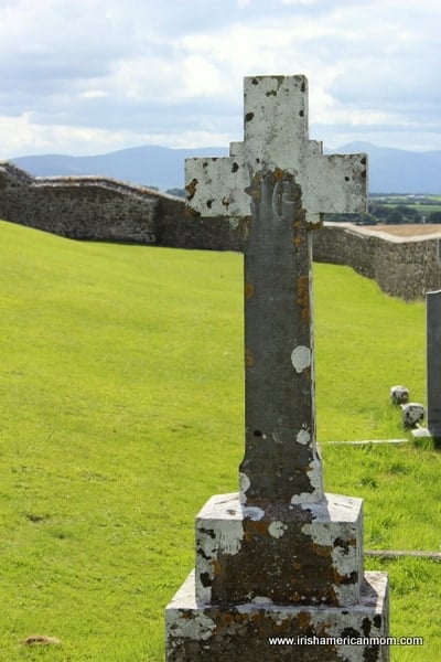Irish Cross In Graveyard At the Rock of Cashel, Co. Tipperary, Ireland | Irish American Mom graveyard cross in a walled green field