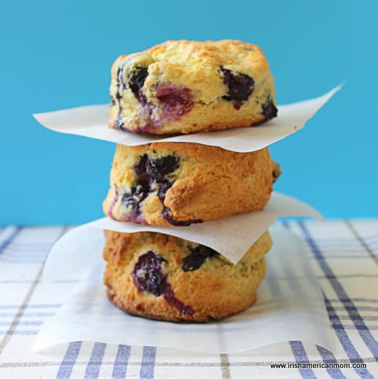 Blueberry Scones stacked high. | Irish American Mom Three blueberry scones stacked on top of each other