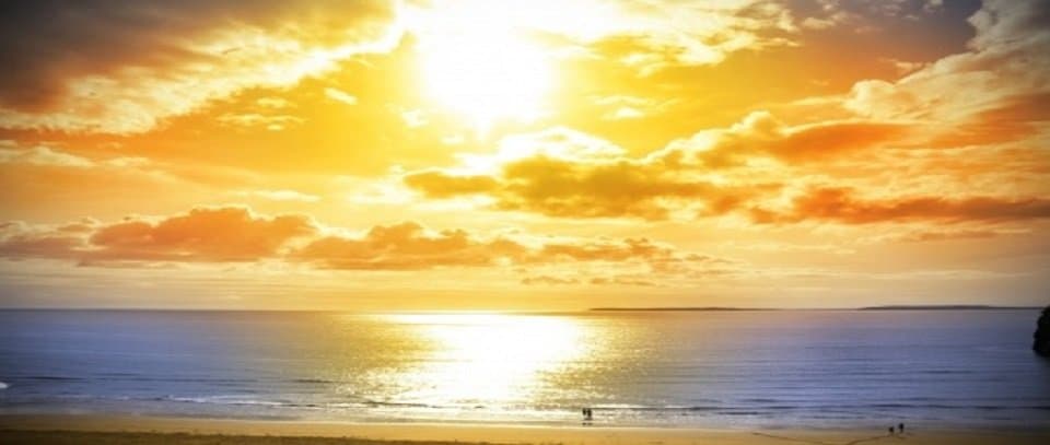 An Irish Sunset over the ocean | Irish American Mom A sunset over a body of water
