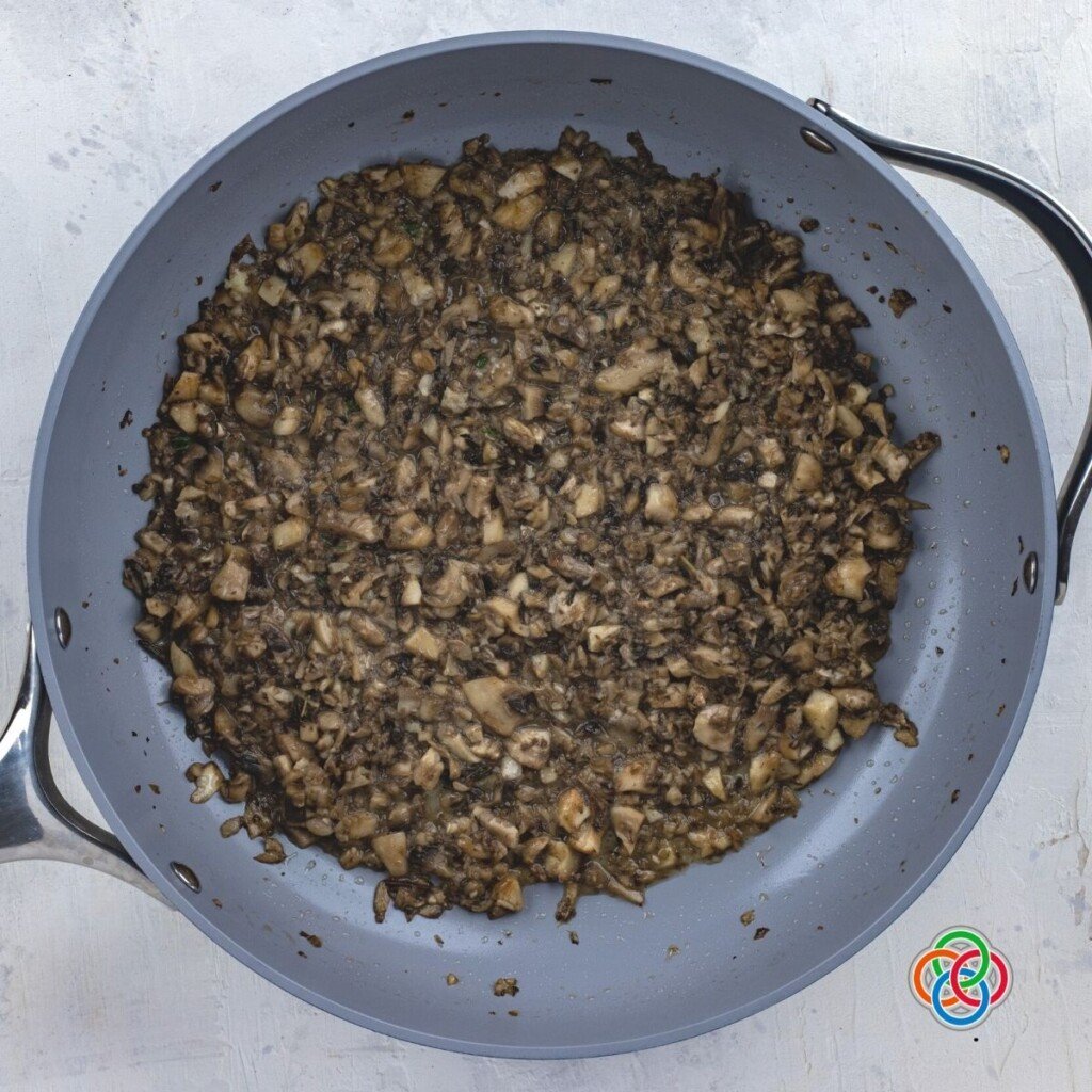 Sauteed mushrooms in a skillet for a potato bite appetizer filling | Irish American Mom Sauteed mushroom bits in a skillet