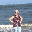 A woman standing on a beach