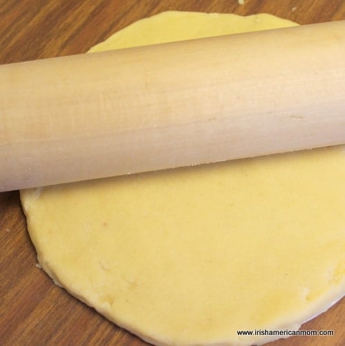 Flattening the top of shortbread with a rolling pin