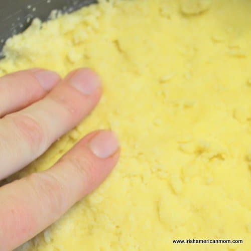 Pressing shortbread into baking pan