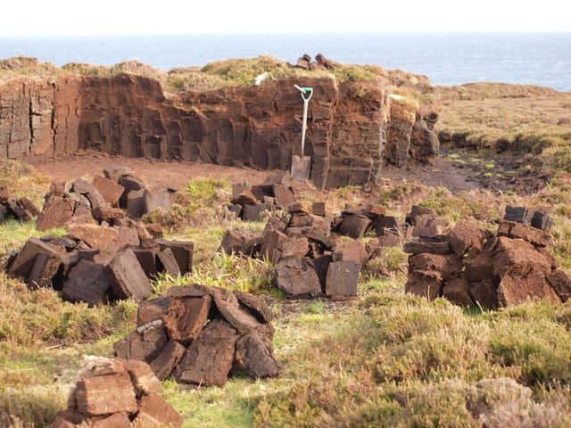 Cutting peat in a bog