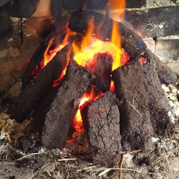Sods of peat or turf burning in an open fire