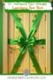 Front door decorated with a large green ribbon and bow for a St. Patrick’s Day leprechaun door block prank, featuring Irish American Mom branding at the bottom.