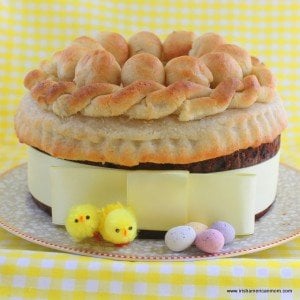 Yellow ribbon around a marzipan topped Easter Simnel Cake
