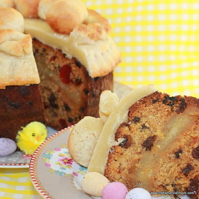 Slice of simnel cake on a plate with mini Easter eggs | Irish American Mom Slice of simnel cake-001