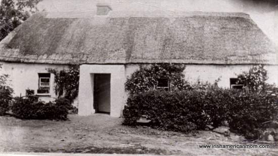 The Old Place - Where Irish American Mom's Dad grew up | Irish American Mom Black and white image of an Irish thatched cottage