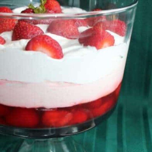 Strawberry and cream layered dessert in a glass dish