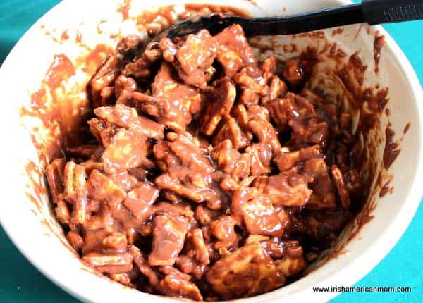 Blending biscuits and melted chocolate for biscuit cake or cookie cake | Irish American Mom Blending biscuits and melted chocolate for biscuit cake or cookie cake