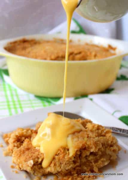 Pouring custard over apple crumble | Irish American Mom Pouring custard over apple crumble
