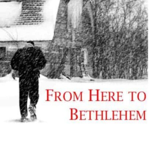 A man in the snow beside a house with text overlay
