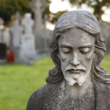 Head of Jesus on a stone statue in a cemetery