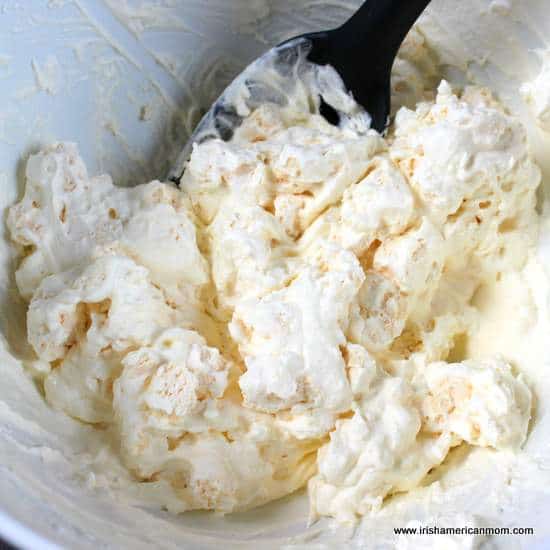 Mixing cream and crumbled meringues for Eton Mess | Irish American Mom Mixing cream and crumbled meringues for Eton Mess