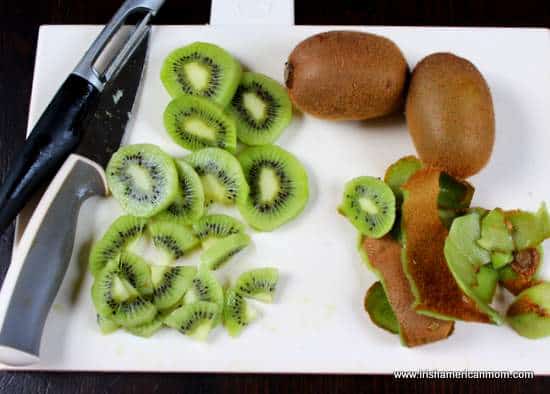 Peeling and slicing kiwis for a parfait dessert | Irish American Mom Peeling and slicing kiwis for a parfait dessert