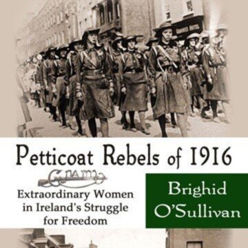 Women marching with a text banner