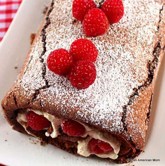 Chocolate swiss roll filled with raspberries and cream