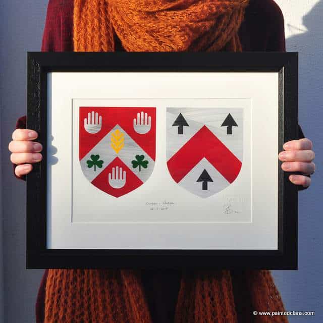 Dual coat of arms family crests in a framed print