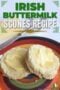 A split Irish buttermilk scone topped with melting butter on a colorful plate, with text overlay