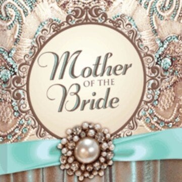 A decorative brocade book cover with a blue ribbon and pearl jewel with a circular frame with text