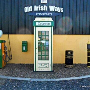 Old telephone booth with text sign above it