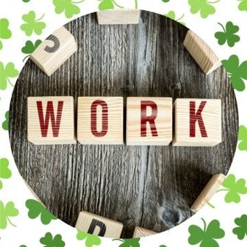 Letter blocks in a circular graphic surrounded by a shamrock border