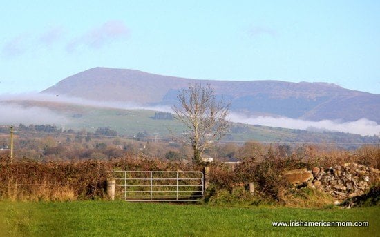Mountain View beyond an iron gate in Ireland | Irish American Mom A line of cloud below the Galtee Mountains in County Limerick