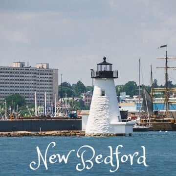 Lighthouse in a harbor with text overlay