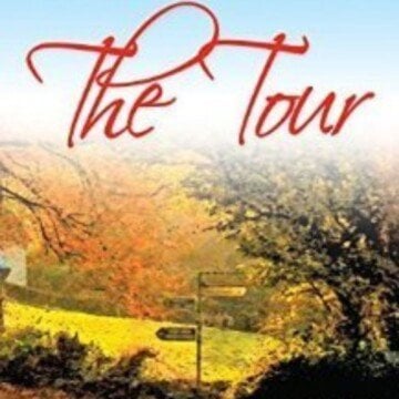 Red Text on a picture of autumn trees, a field and a sign post