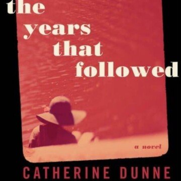 Red book cover with text and a woman sitting beside a body of water