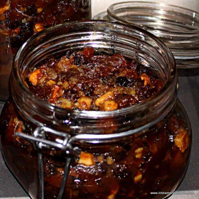 Festive Mincemeat for Christmas | Irish American Mom A glass jar with mincemeat with the attached lid open.