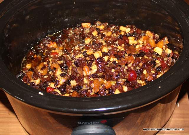 Mincemeat pie filling cooking in a crock pot or slow cooker | Irish American Mom Mincemeat pie filling in a slow cooker or crock pot.
