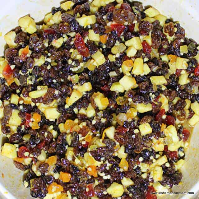 Mixture for mincemeat pie filling | Irish American Mom Dried fruits and diced apples in a bowl.