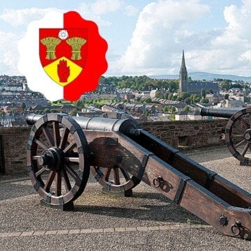 Cannons beside a wall with a superimposed coat of arms