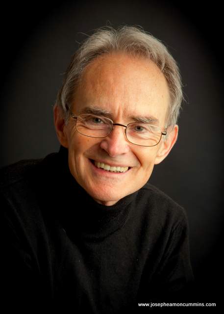 A man in glasses looking at the camera