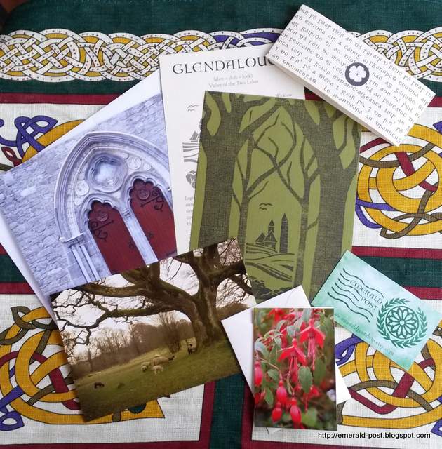 A stack of cards and envelopes spread out on a Celtic pattern background