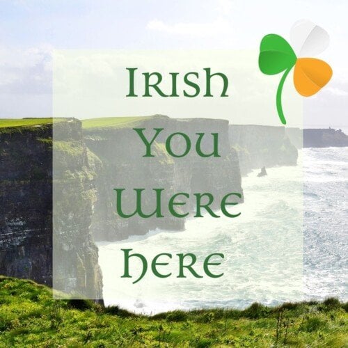 Sea cliffs with a text overlay and shamrock