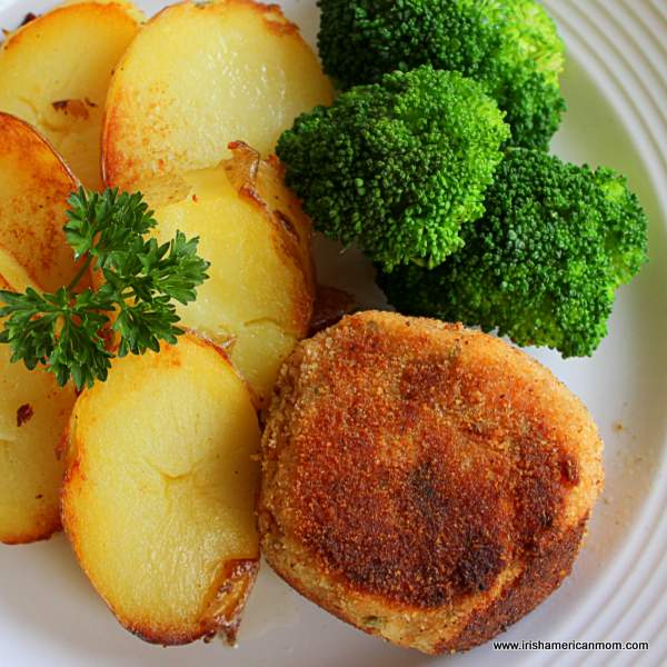 Fried Irish potatoes, broccoli and salmon fish cake | Irish American Mom A plate of food with broccoli, salmon cakes and fried potato slices