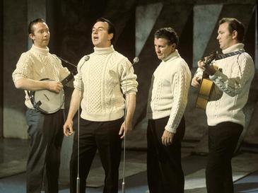 The Clancy Brothers were a traditional Irish band | Irish American Mom A group of people singing and playing instruments
