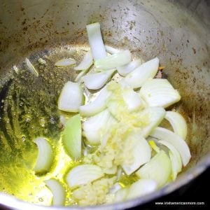 Onions cooking in melted butter in a saucepan
