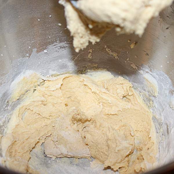 Adding flour on low speed for Eve's pudding batter | Irish American Mom Folding flour into the batter for a sponge mixture.