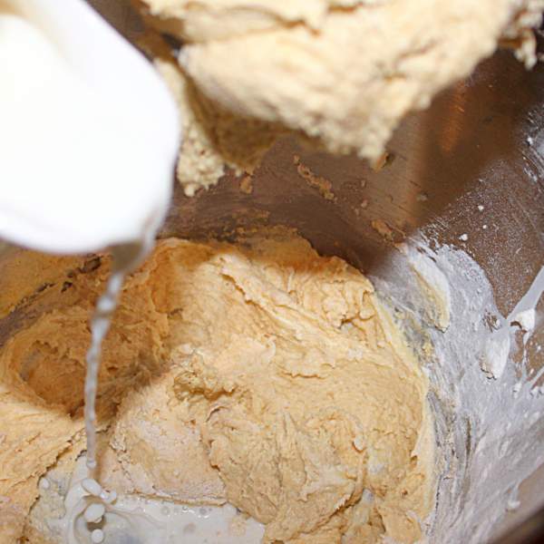 Adding milk to sponge batter for Eve's pudding | Irish American Mom Loosening a sponge pudding batter with a little milk.