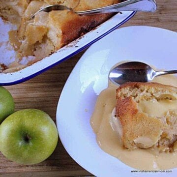 Custard over apple sponge pudding in a bowl