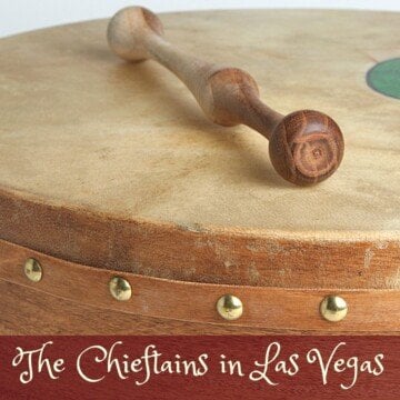 Bodhran drum with a stick and text banner