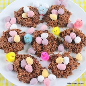 A plate of chocolate Easter nests for kids | Irish American Mom A white plate with seven chocolate nests with mini eggs