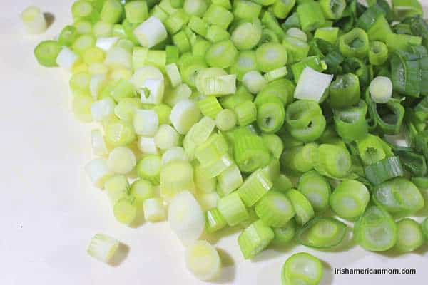 https://www.irishamericanmom.com/wp-content/uploads/2018/03/Diced-scallions-or-green-onions-for-Irish-champ.jpg